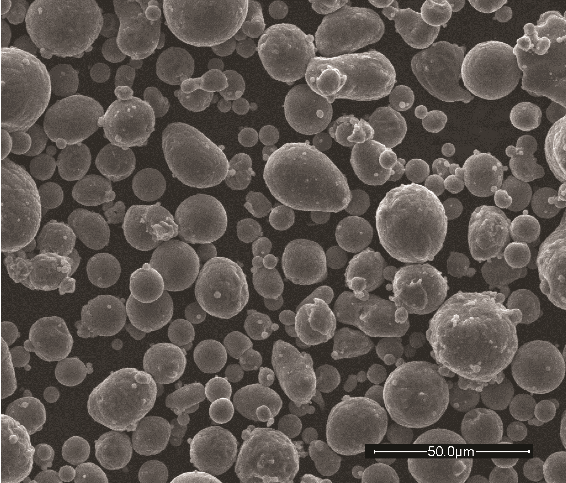 A scanning electron micrograph of the raw aluminium powder confirms the regular shape and relatively smooth surface of the gas atomised particles